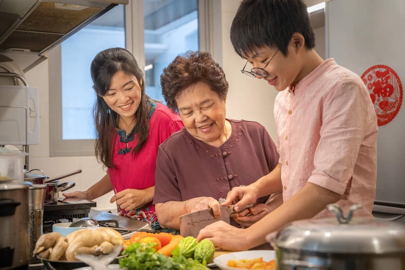 Grandma cooking in the kitchen with her grandchildren