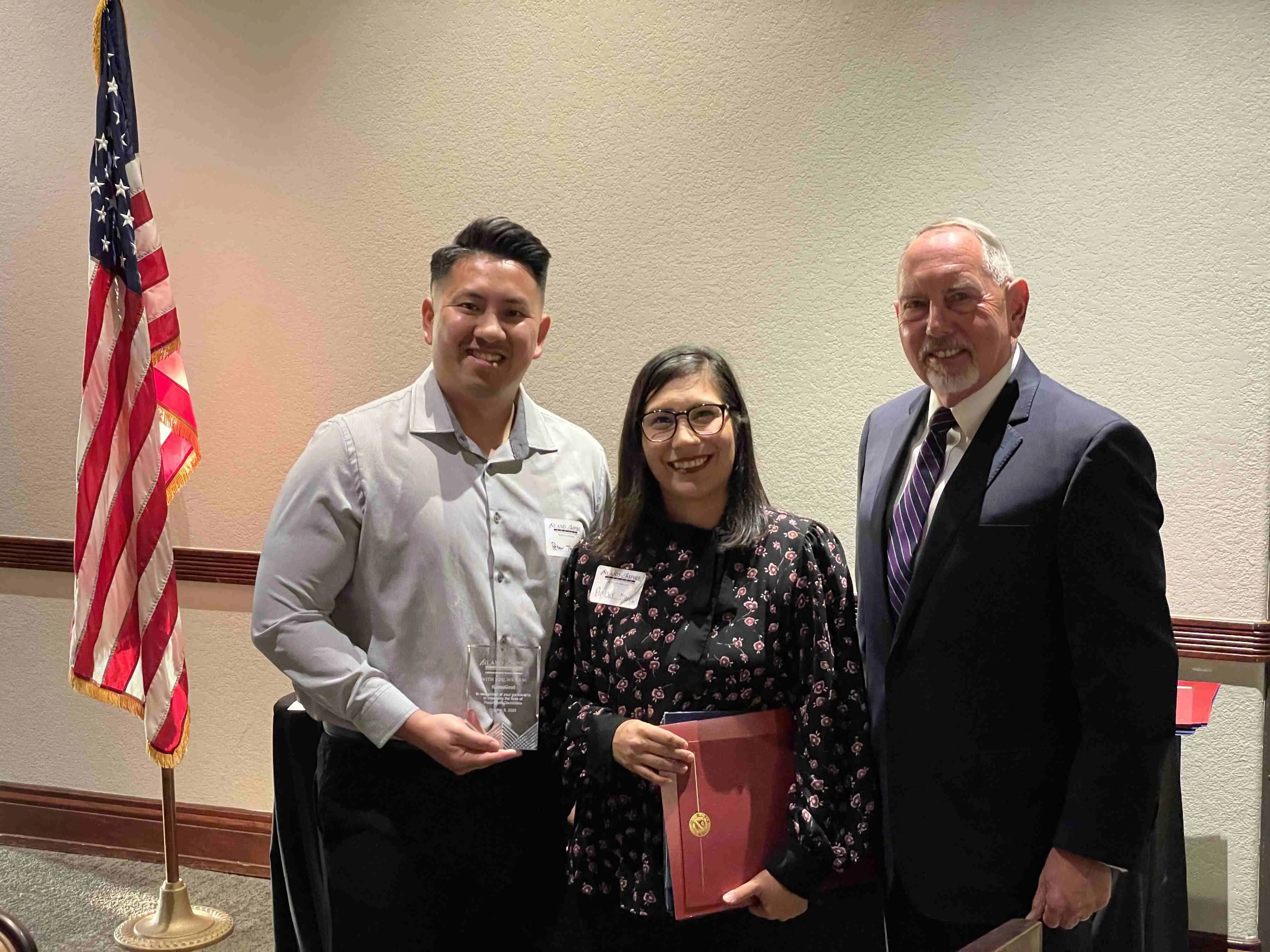 Peter Tran, Amber Mora, and Senator Richard D. Roth