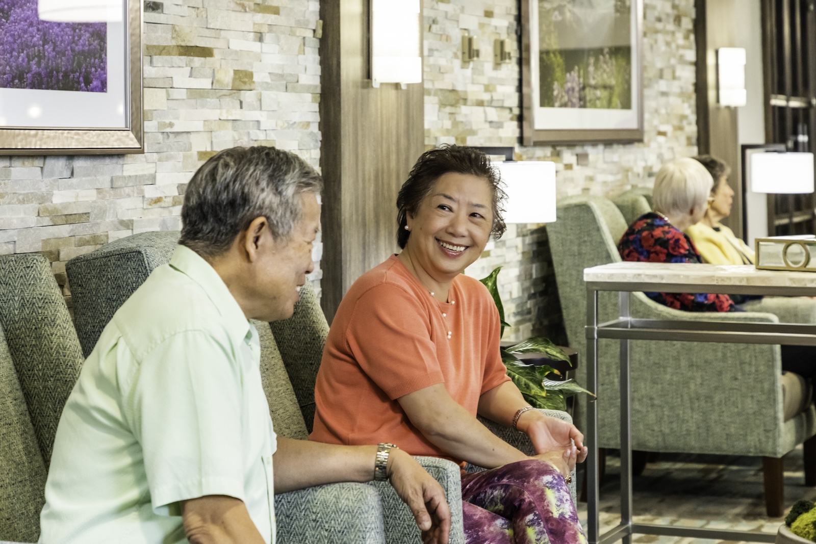 two HumanGood residents sitting and talking